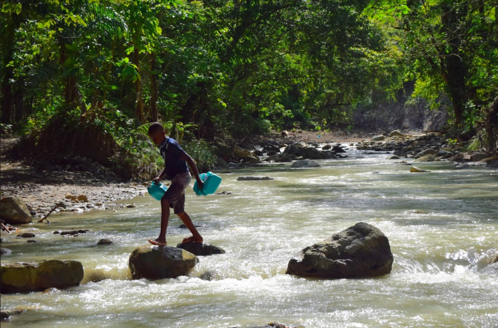 Boy carrying water